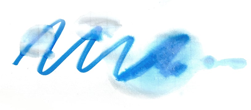 An abstract watercolor illustration in blue tones, featuring a wavy, flowing brushstroke with soft, scattered color splashes.